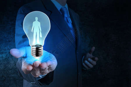 商业家使用灯泡选择人作为人力资图片