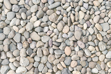 卵石堆作为抽象的自然背景大量灰色和棕色砾石在特写视图中各种鹅卵图片
