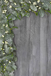 圣诞和冬天以生锈的灰色木本背景为背景图片