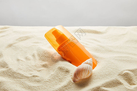 橙色瓶装防晒霜沙图片