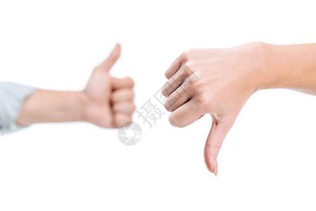 女和男在白色上显示拇指向上和拇指向图片