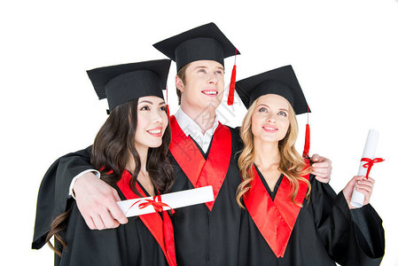 成绩优异的学生在学术帽子上站着带着孤背景图片