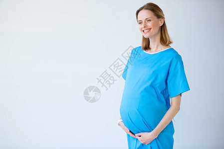 带着微笑的caucasians孕妇站着图片