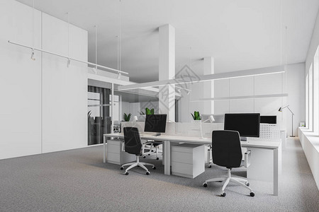 以白色墙壁地毯板和黑椅白电脑桌排成的白色桌子为圆角的工业风格图片