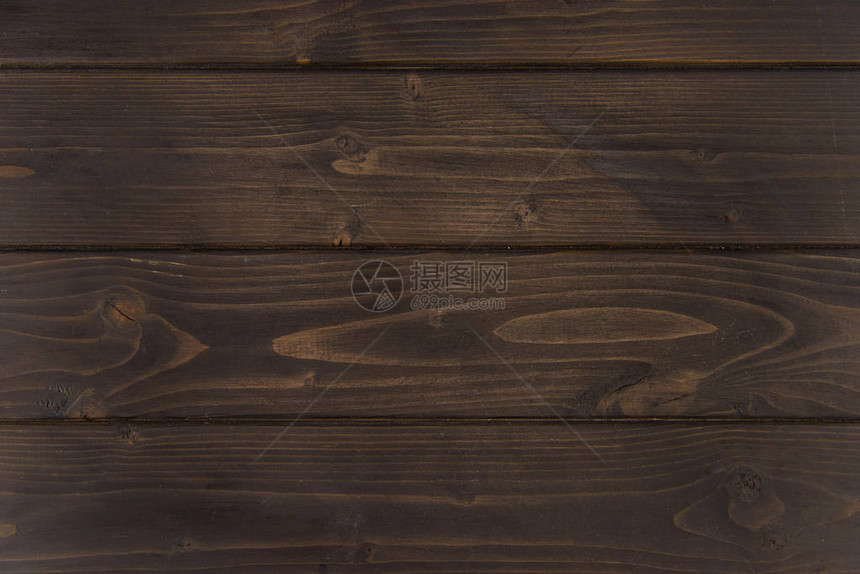 深棕色木质水平木板木质背景的特写视图图片