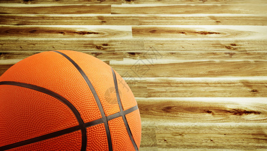 篮球和木地板的特写背景图片