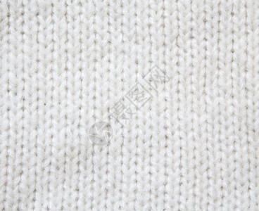 白色羊毛钩针织毛衣背景特写图片