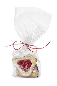 心形饼干和草莓果酱在透明袋上图片