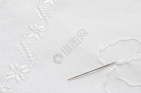 针线和白丝线大型手工刺绣用缝合的刺图片