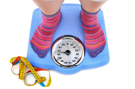 胖女人身体在比例尺和测量胶图片