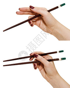 手中的筷子被白色隔离图片