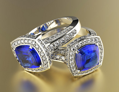 背景上镶有蓝色钻石的珠宝戒指图片