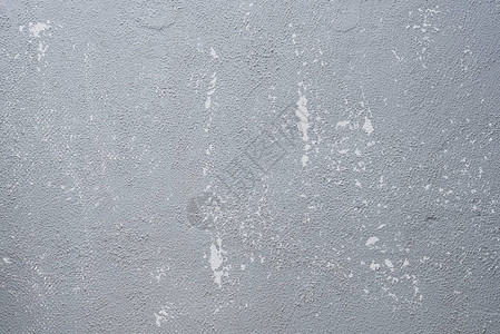 混凝土墙上涂有划痕和遇险纹理的灰色旧布料背景摘要背景