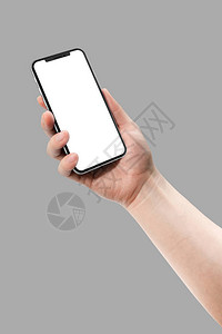 女人手拿着智能手机与灰色背景上孤立的空白屏幕模板样机模型图片