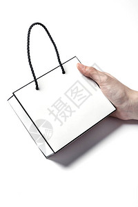 妇女手拿着一个空白空纸购物袋图片