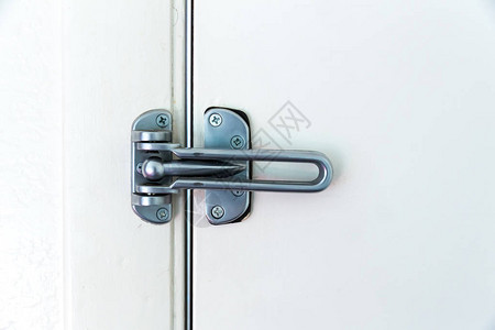 白色背景上带球锁的不锈钢门铰链图片