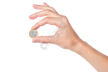 手拿着1欧元硬币在白色背景上被隔离图片