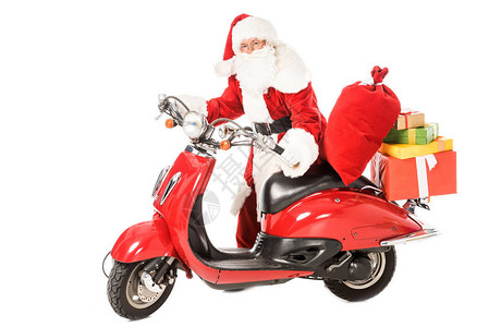 圣诞老人推着老式红色滑板车袋子和礼品图片