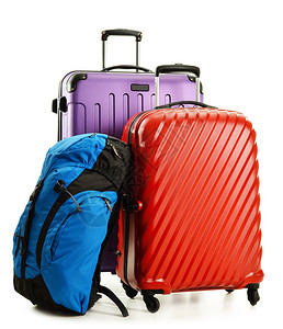 帆布背包行李包括大型手提箱和在白色背景