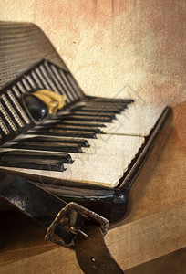 老手风琴用老式的手风琴浅背景图片