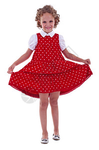 微笑的小女孩玩着红裙子图片