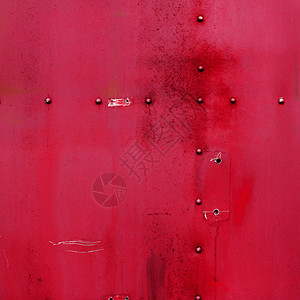 抽象画哑光红色金属背景纹理与铆钉图片