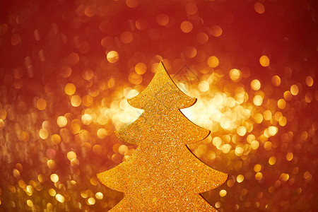 金色闪亮的圣诞树红底装背景图片