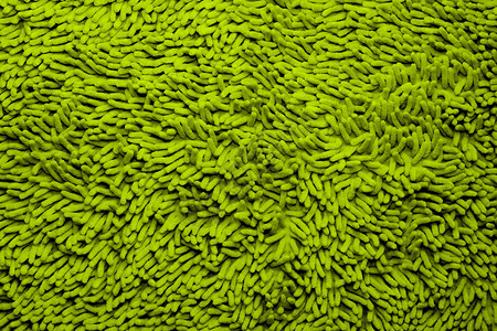 背景中的绿色超细纤维浴垫图片