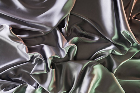 银色和绿色柔软的丝绸面料背景图片