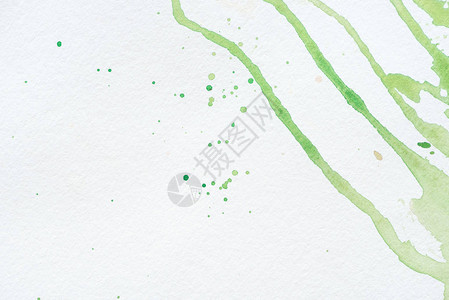 白纸上的抽象绿色水彩污渍和飞溅图片