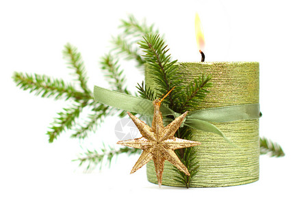 烧圣诞蜡烛绿色丝带黄金新年星图片