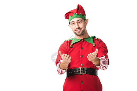 穿着圣诞精灵服装微笑的男人用伸展的手姿势背景图片