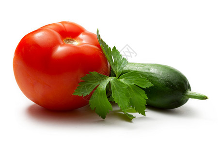 白色背景中的番茄欧芹黄瓜图片