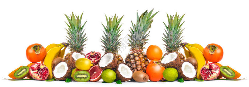 新鲜的热带水果菠萝椰子猕猴桃橙子石榴葡萄柚在一个木制的背景上顶视图文图片