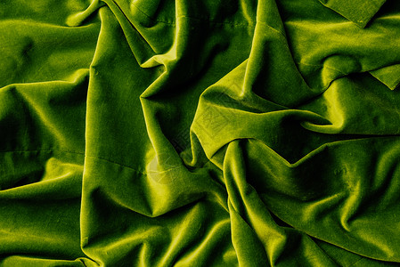 绿色天鹅绒纺织品为背图片