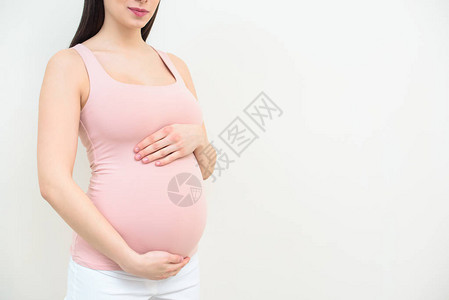 孕妇将腹部绑在白衣图片