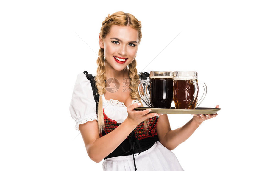 穿着传统的德国服装的美丽女服务员在OktoberFest盛宴