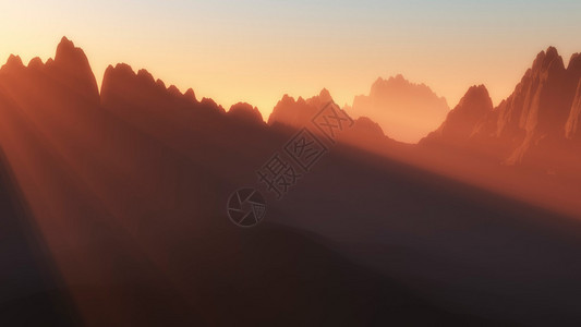 日落时有太阳光束的山峰剪影图片