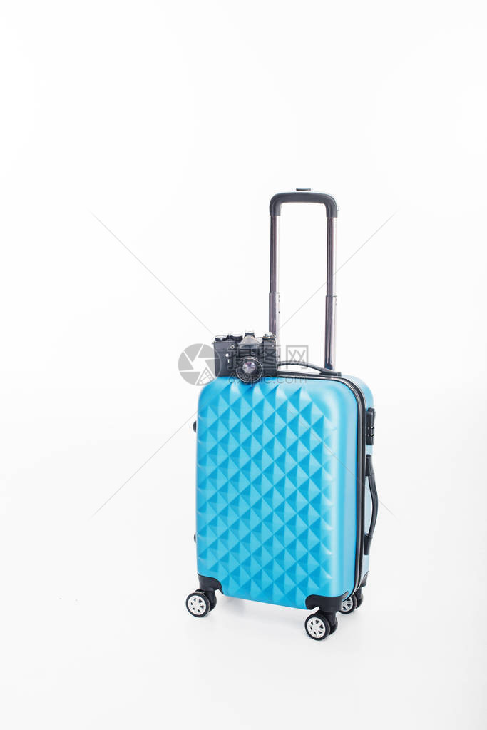 蓝色行李袋和照相机图片