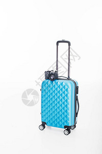 蓝色行李袋和照相机背景图片