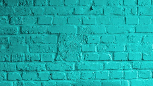 用灰浆绿松石色特写的砖墙背景图片