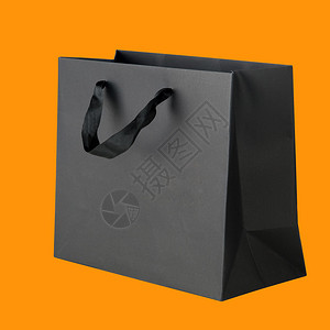 橙色的黑色购物袋背景图片