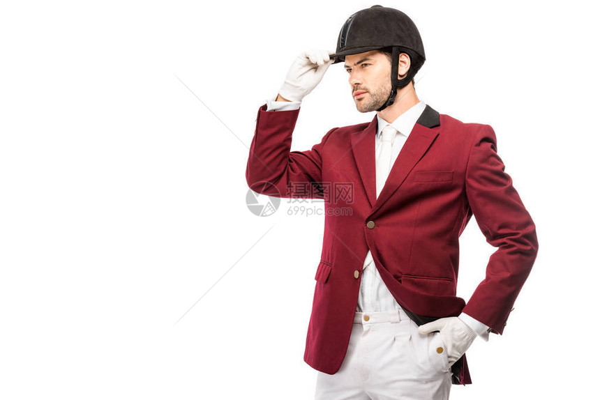 身穿制服和头盔的有魅力的年轻骑手在白图片
