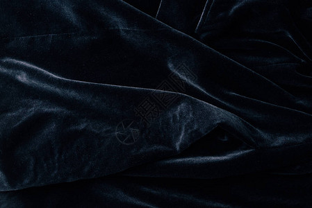 黑色天鹅绒纺织品为背图片