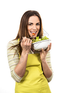烹调和吃健康食物的少妇菜沙拉饮食节食的概念健康的生活方式在家做图片