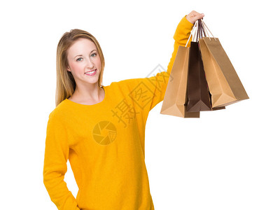 妇女拿着购物袋在白色背图片