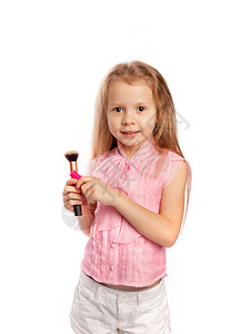 小女孩手拿着唇膏和化图片