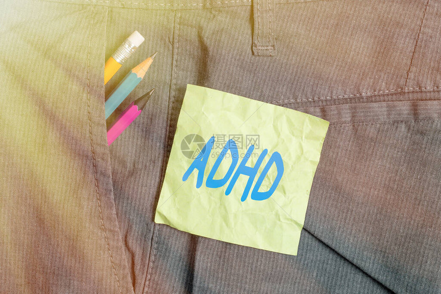 概念手写显示Adhd概念意义儿童多动症心理健康障碍注意力不集中的书写设备和裤袋中图片
