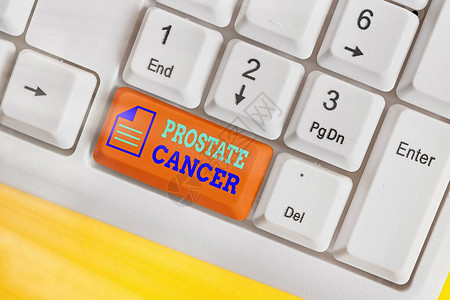 显示前列腺癌的书写笔记男生殖系统癌症发展的商业概念白色pc键盘背景图片