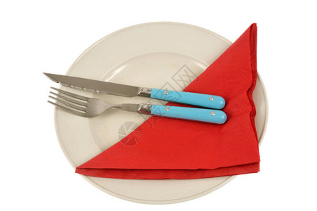配餐具和餐巾纸的餐板图片